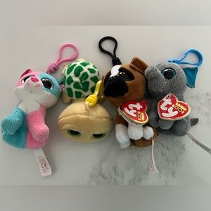 Four Ty beanie boos with key clips.  They measure approx 4” long.
